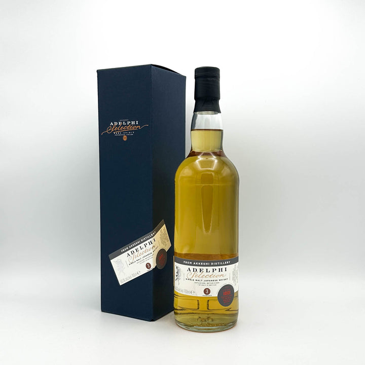 Adelphi whiskey bottle with box on a white background