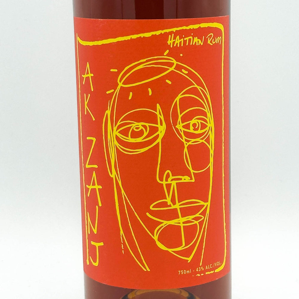 Bottle of Akinanj with a red label featuring a stylized face design on a white background