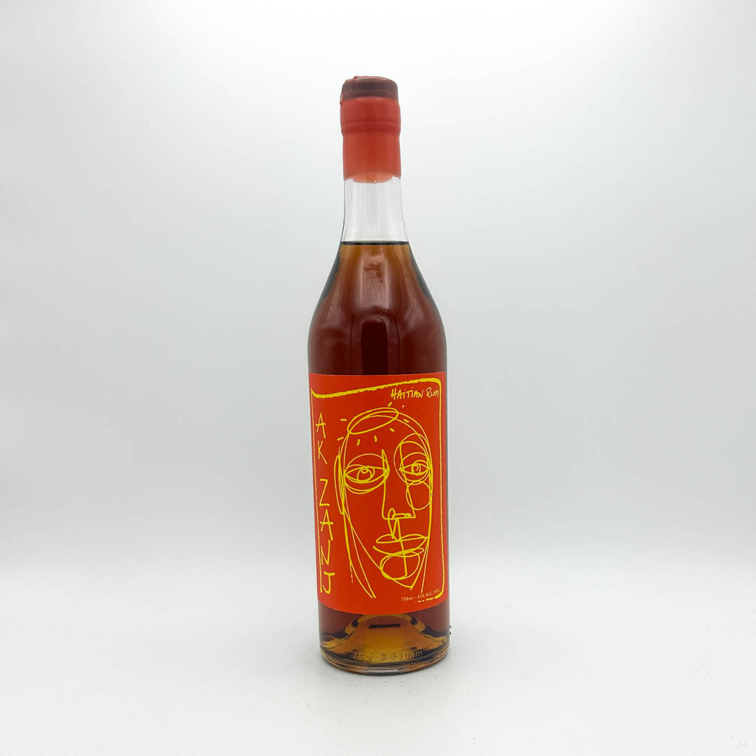 Bottle of alcohol with a red label featuring a face design on a white background
