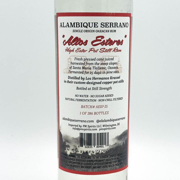 Alambique Serrano rum bottle label on a white background