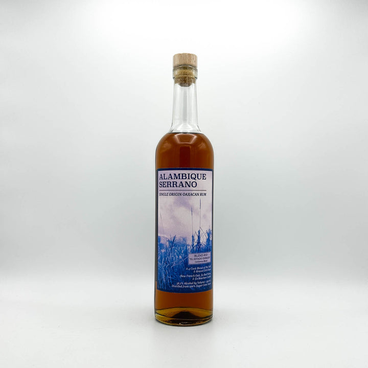Bottle of Alambique Serrano rum on a white background