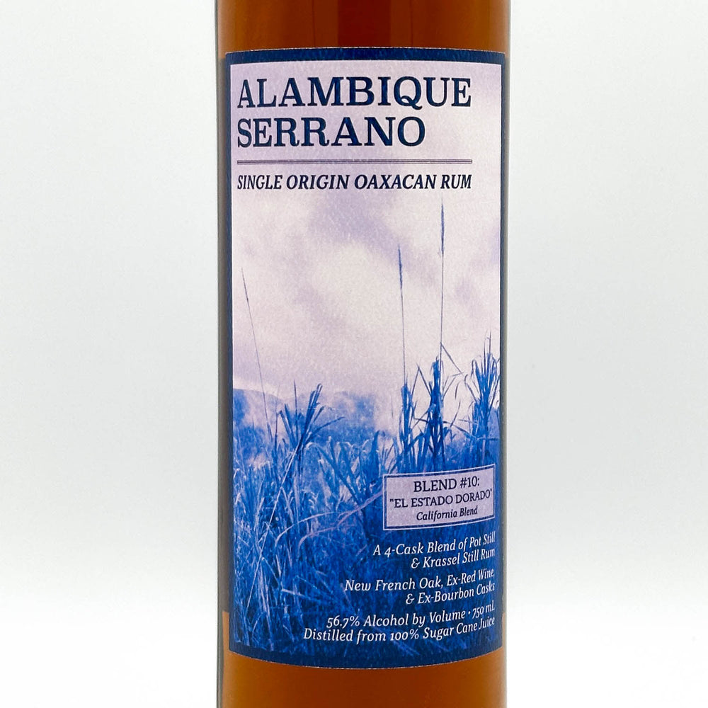 Alambique Serrano rum bottle with label on a white background