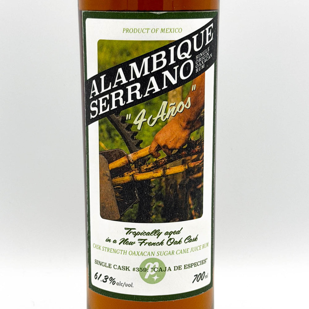 Alambique Serrano bottle with label on a white background