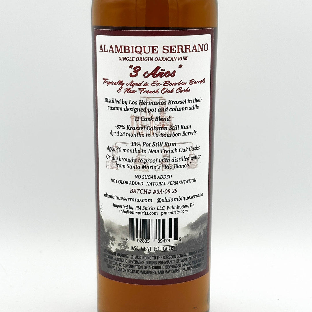 Alambique Serrano rum bottle label on a white background