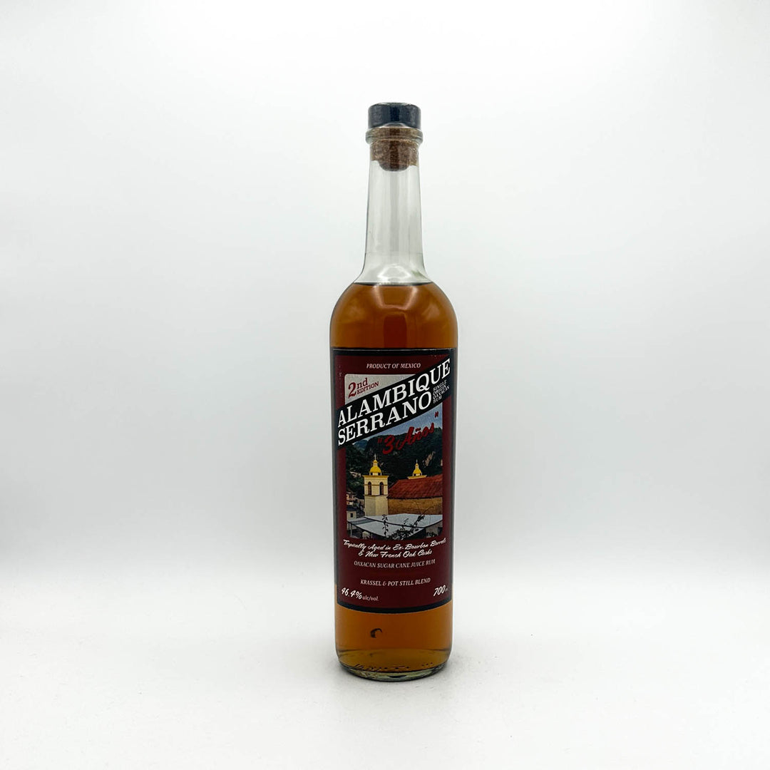 Bottle of Alambique Serrano rum on a white background
