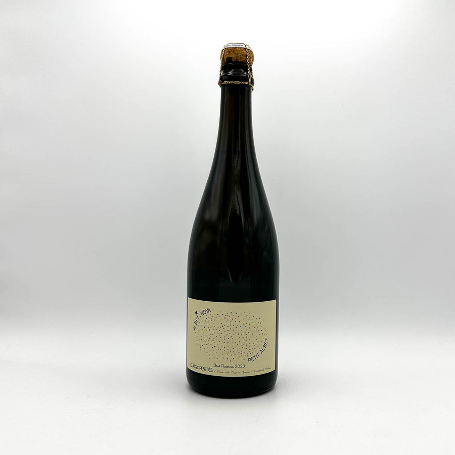 Dark bottle with a label on a white background