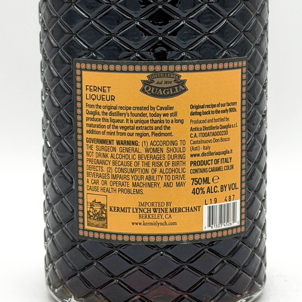 Bottle of Fernet Liqueur with a textured surface and visible label on a white background