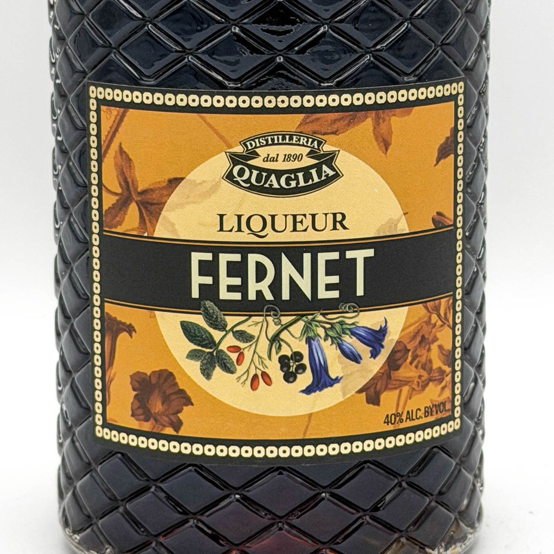 Fernet liqueur bottle with decorative label on a white background