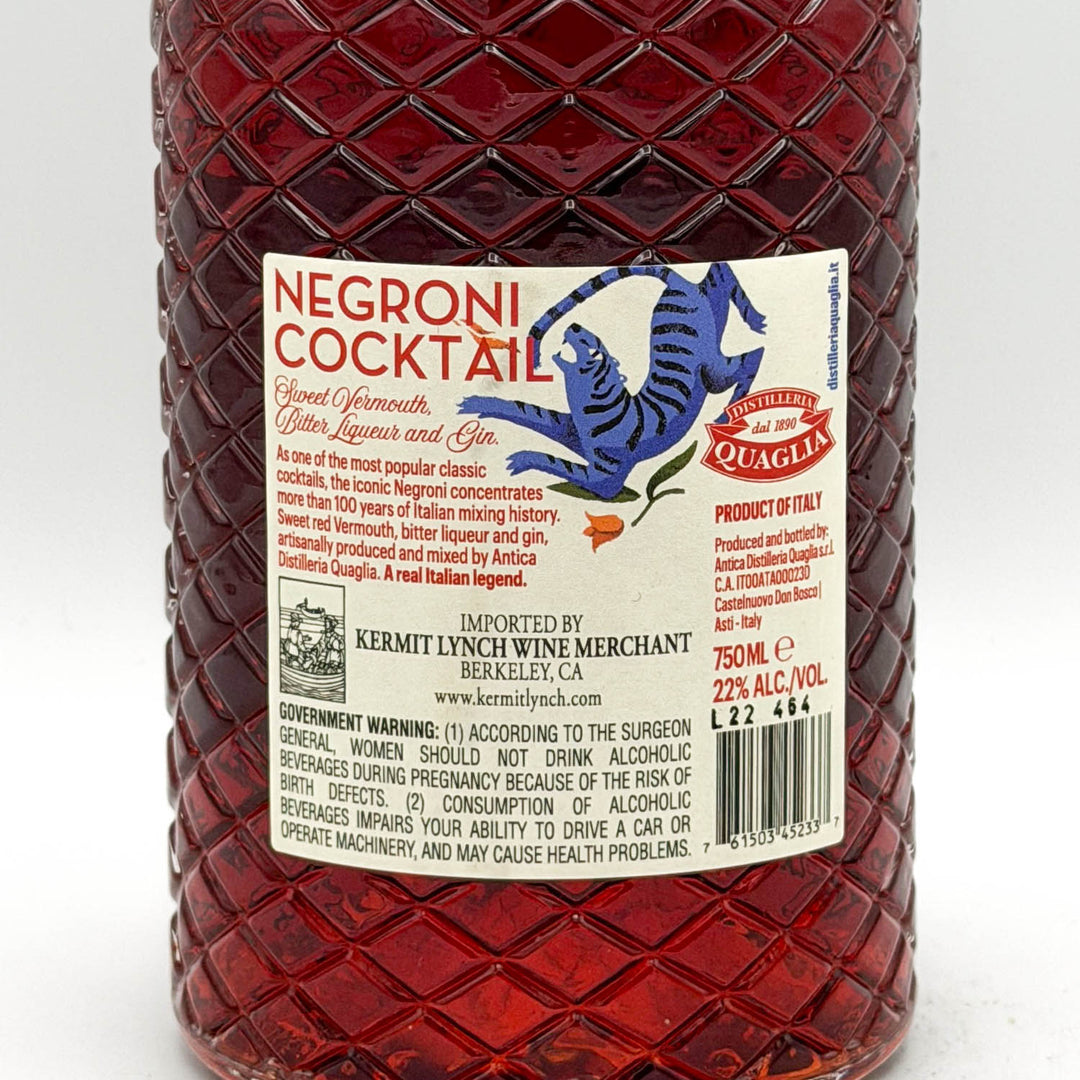 Bottle of Negroni cocktail with a Quaglia label on a white background