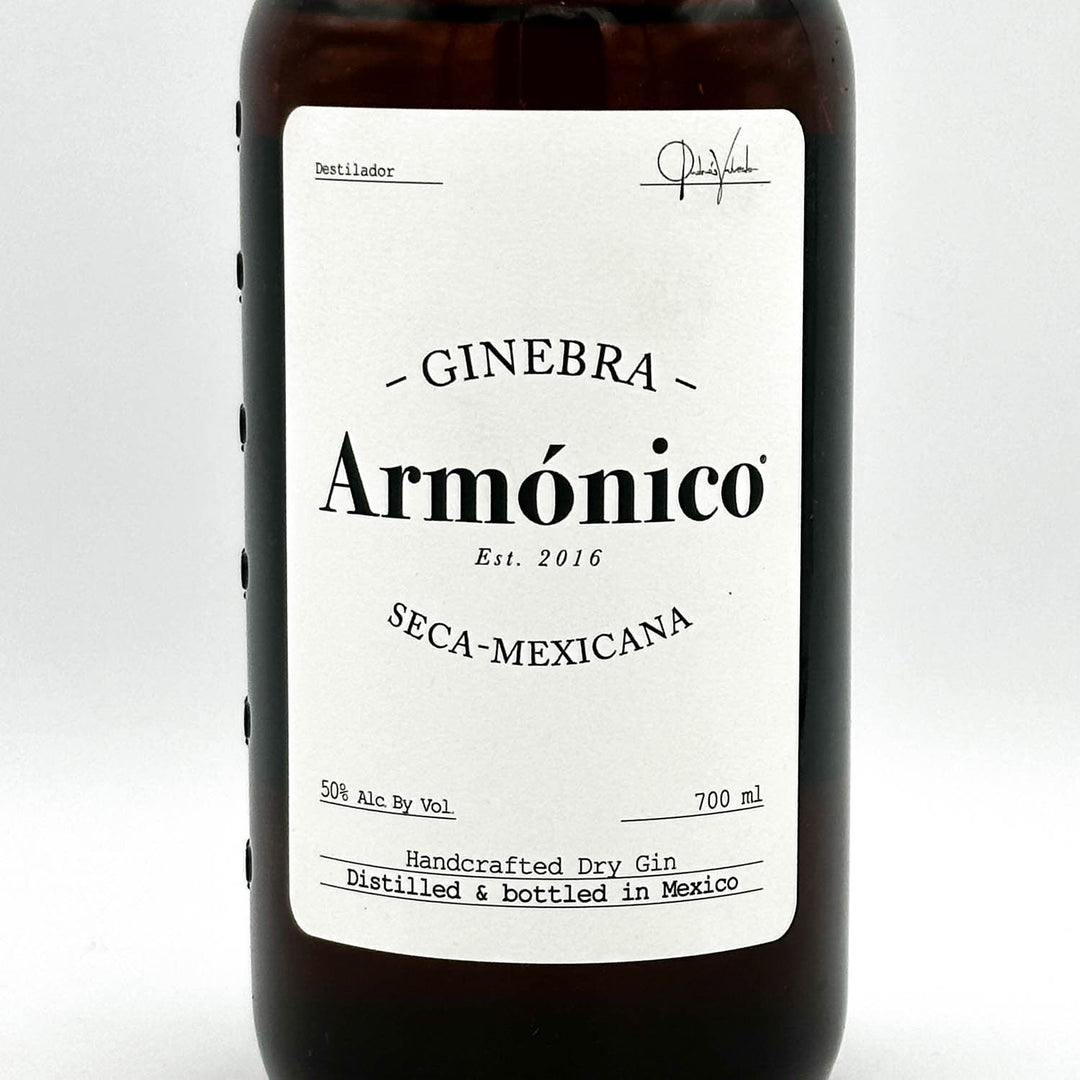 Bottle of Ginebra Armónico with a white label on a light gray background