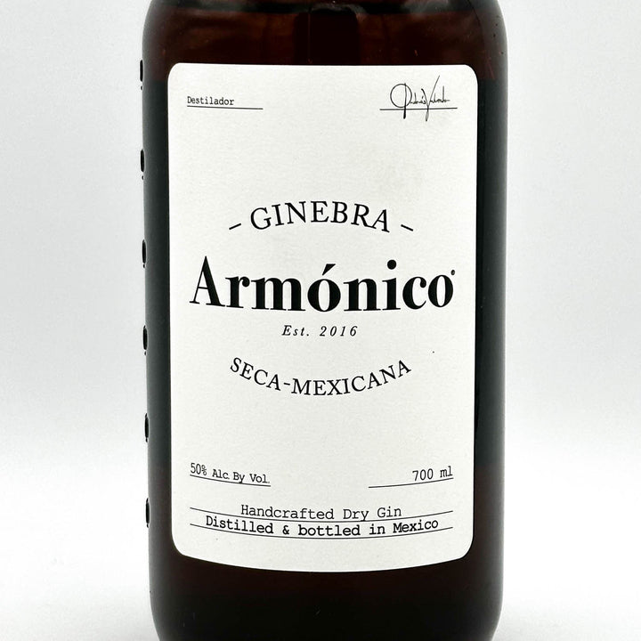 Bottle of Ginebra Armónico with a white label on a light gray background