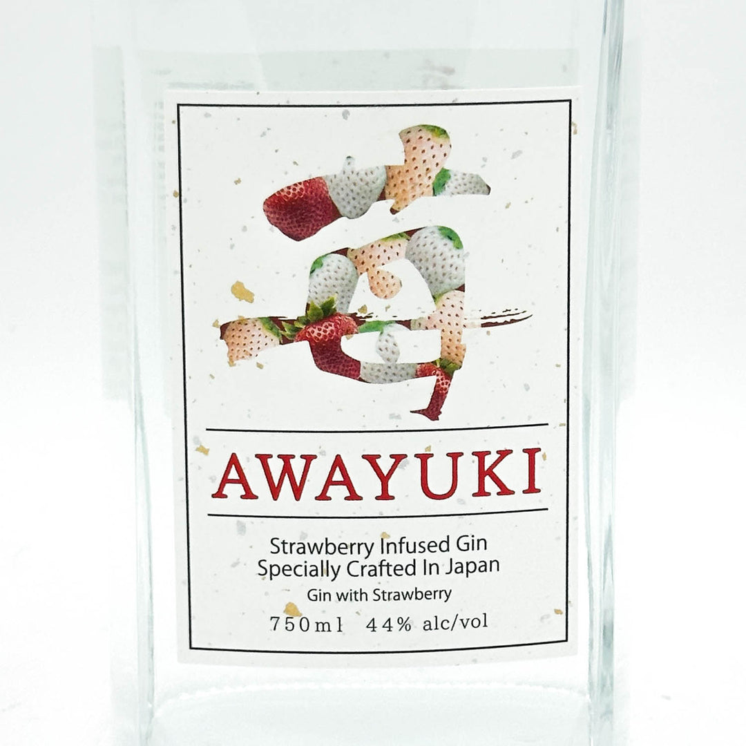A clear glass bottle of AWAYUKI Strawberry Infused Gin, featuring a white label with a strawberry illustration and product details.