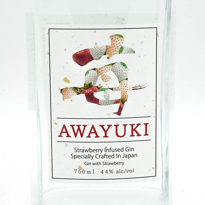 A clear glass bottle of AWAYUKI Strawberry Infused Gin, featuring a white label with a strawberry illustration and product details.