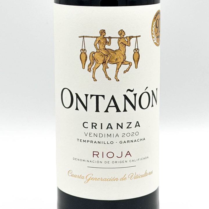 A bottle of Ontañon Crianza Rioja red wine, featuring a dark glass bottle with a white label and a dark red foil capsule at the neck, set against a plain light gray background.