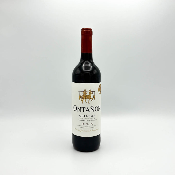A bottle of Ontañon Crianza Rioja red wine, featuring a dark glass bottle with a white label and a dark red foil capsule at the neck, set against a plain light gray background.