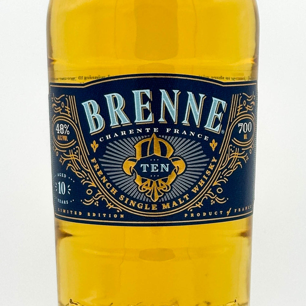 Brenne Cárènte France whiskey bottle with blue label on a white background