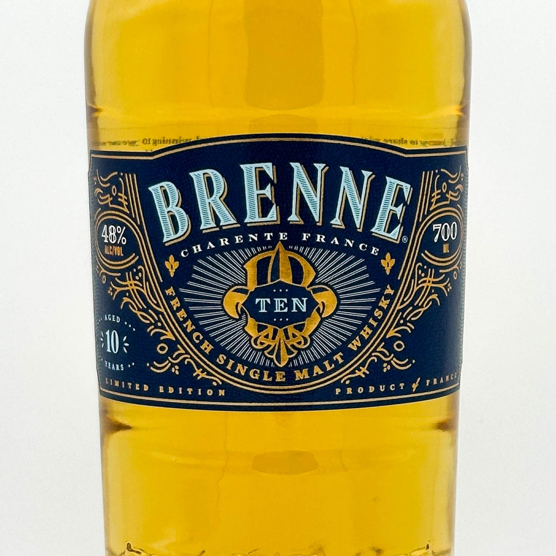 Brenne Cárènte France whiskey bottle with blue label on a white background