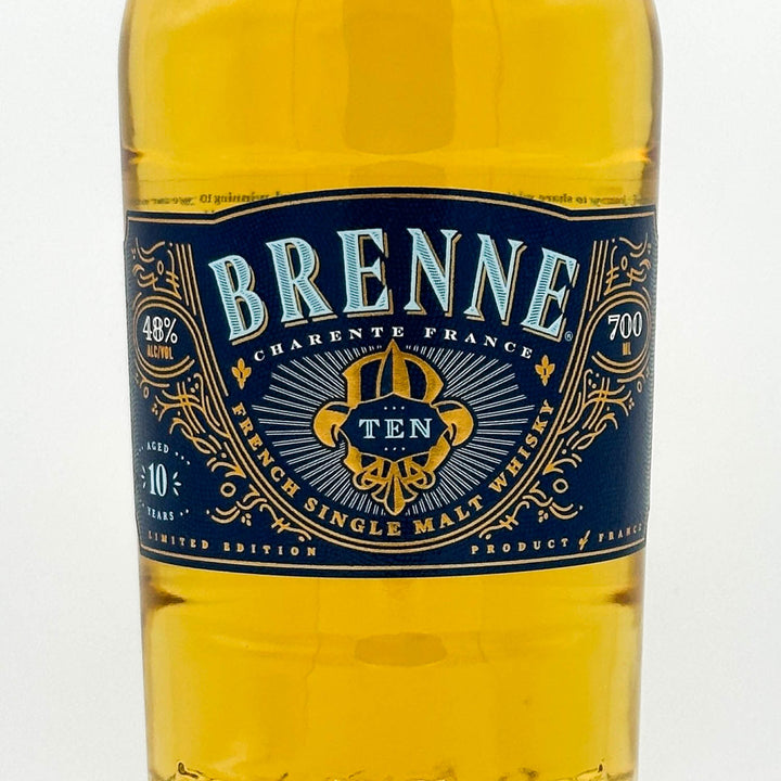 Brenne Cárènte France whiskey bottle with blue label on a white background