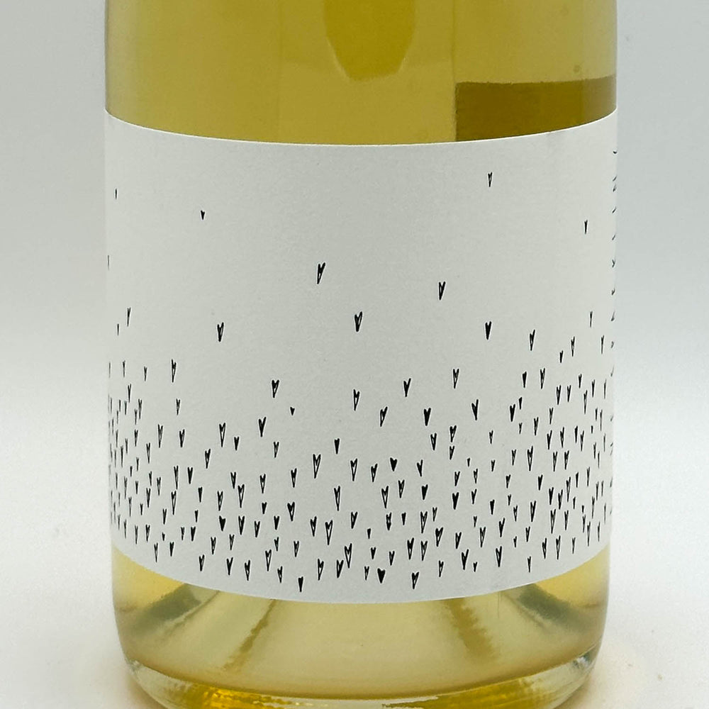 Wine bottle with a white label featuring black patterns on a light gray background