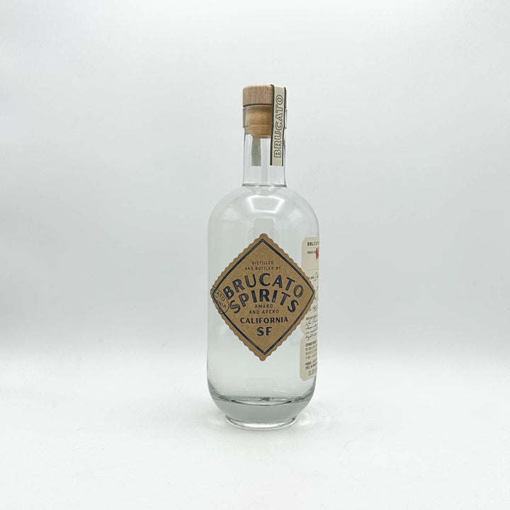 Clear glass bottle with wooden cork cap on a white background