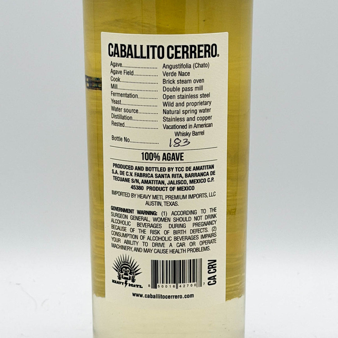 Back label of a Caballito Cerrero tequila bottle on a white background
