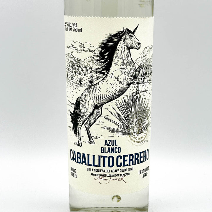 Bottle of Azul Blanco Caballito Cerrero with a horse illustration on the label.