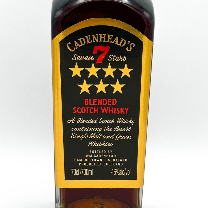Bottle of Cadenhead's Seven Stars Blended Scotch Whisky with label on a white background