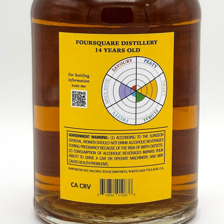Bottle of Foursquare Distillery 14 years old whiskey with a yellow label on a white background
