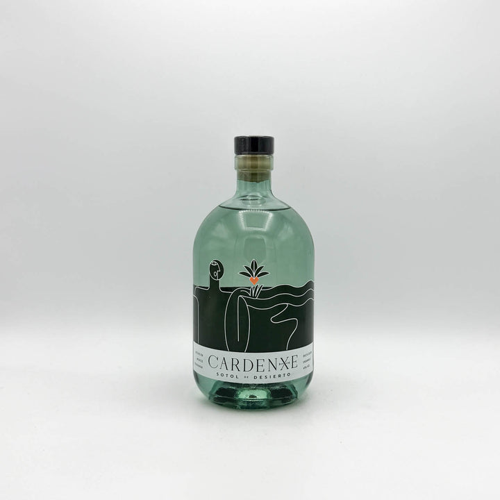 Green bottle with a black label on a white background