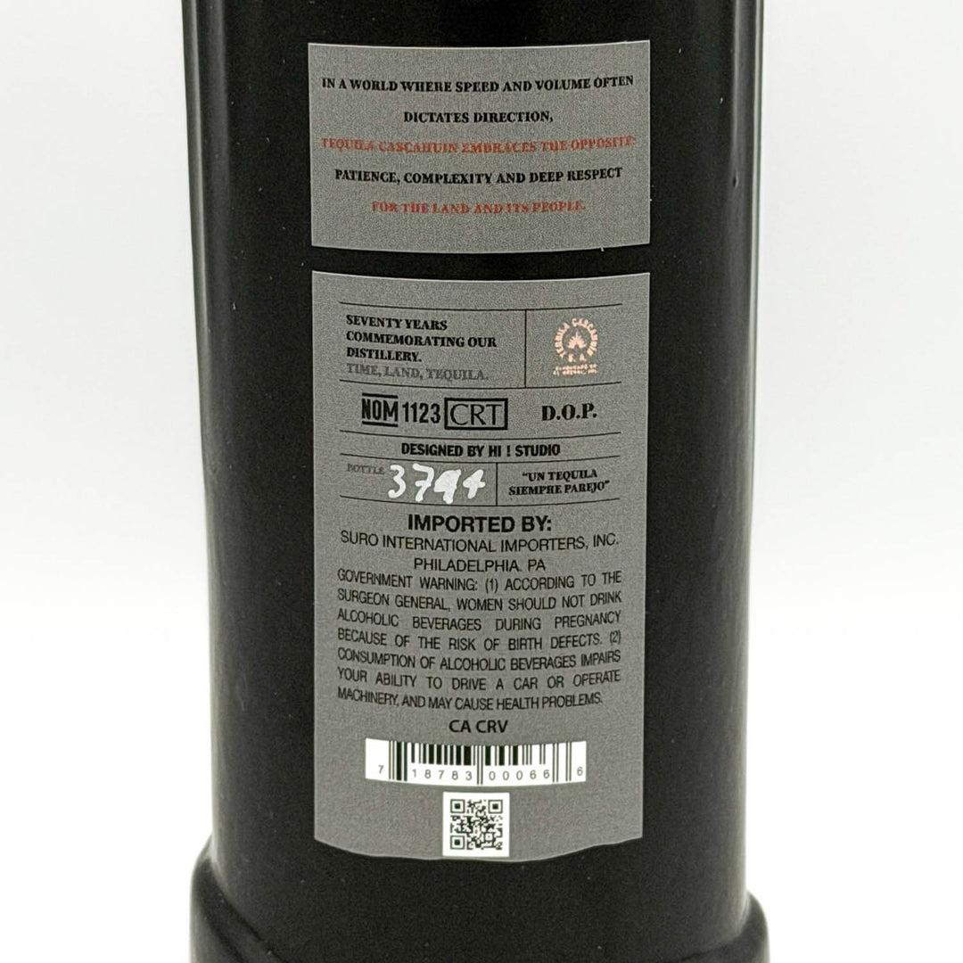 Tequila bottle label with text and barcodes on a white background