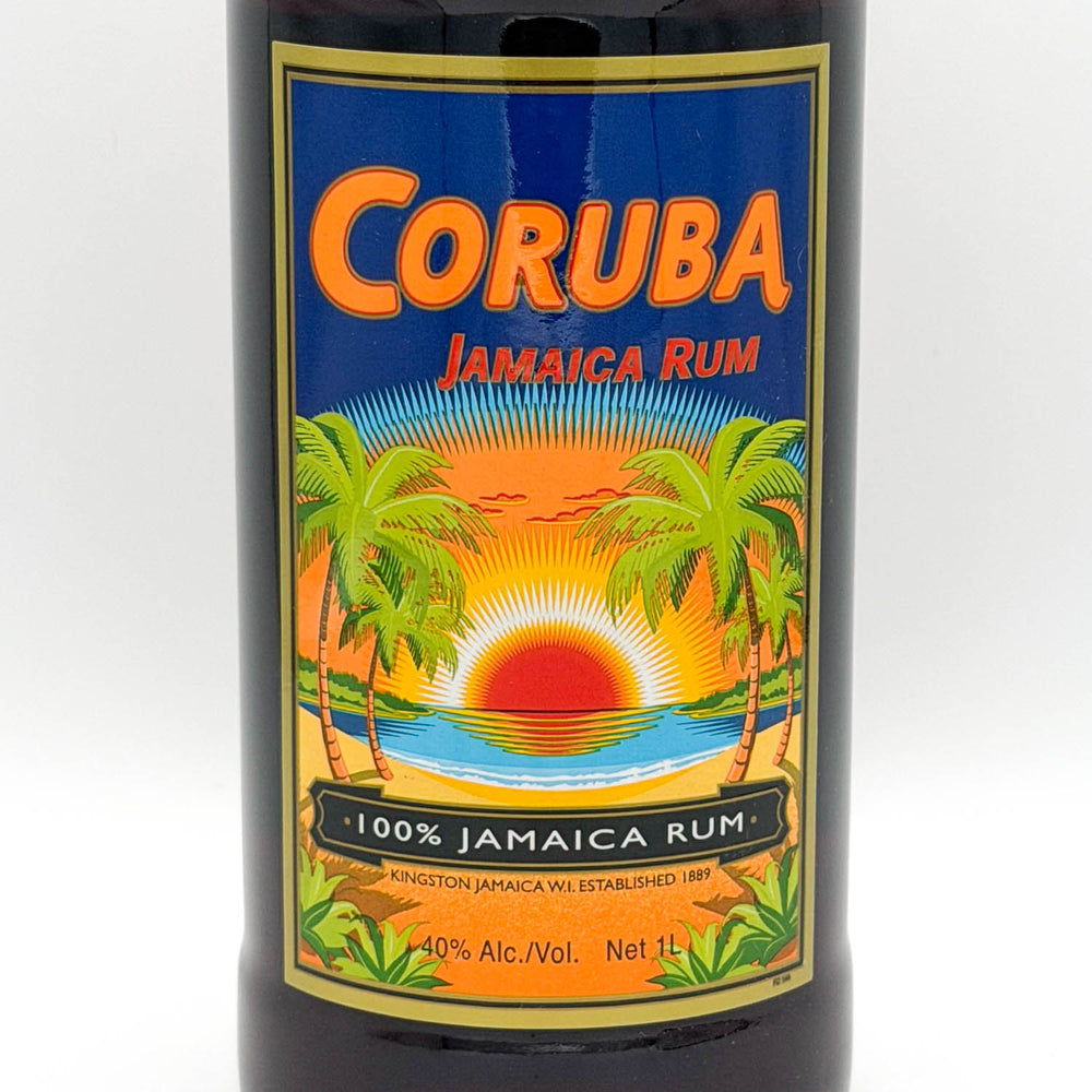Coruba Jamaica Rum bottle with a colorful label featuring palm trees and a sunset.