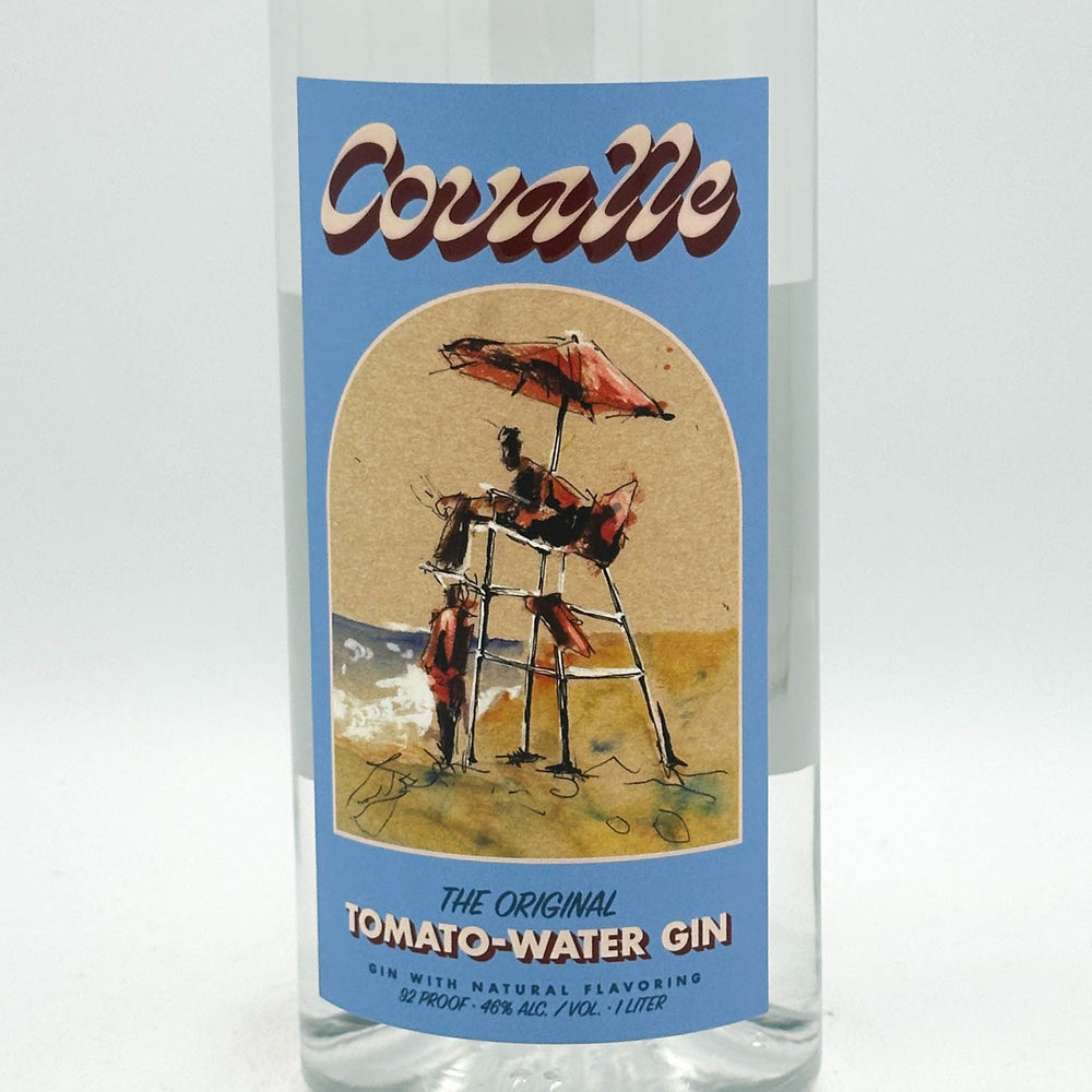 A clear glass bottle of CovalleTomato-Water Gin with a vintage-style blue label, photographed against a neutral light gray background.
