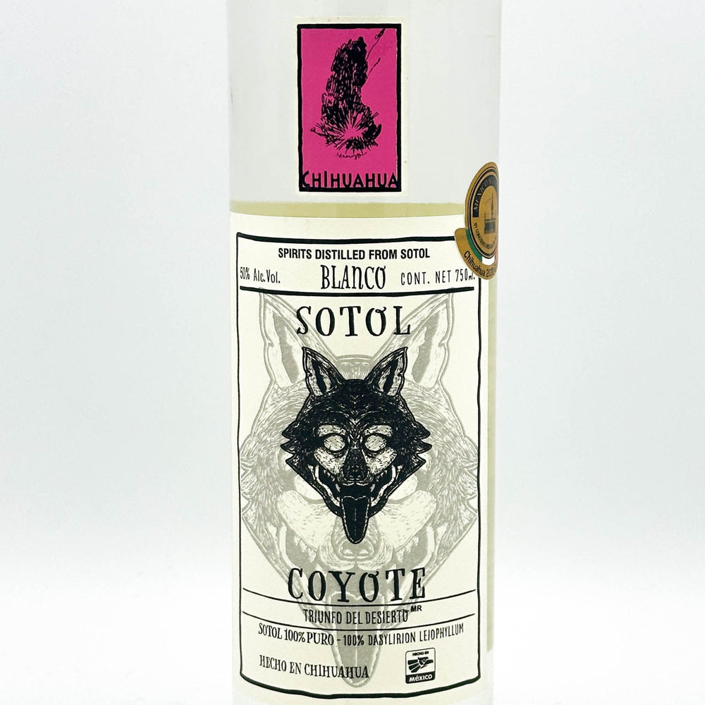 Sotol bottle with label featuring a wolf design on a white background