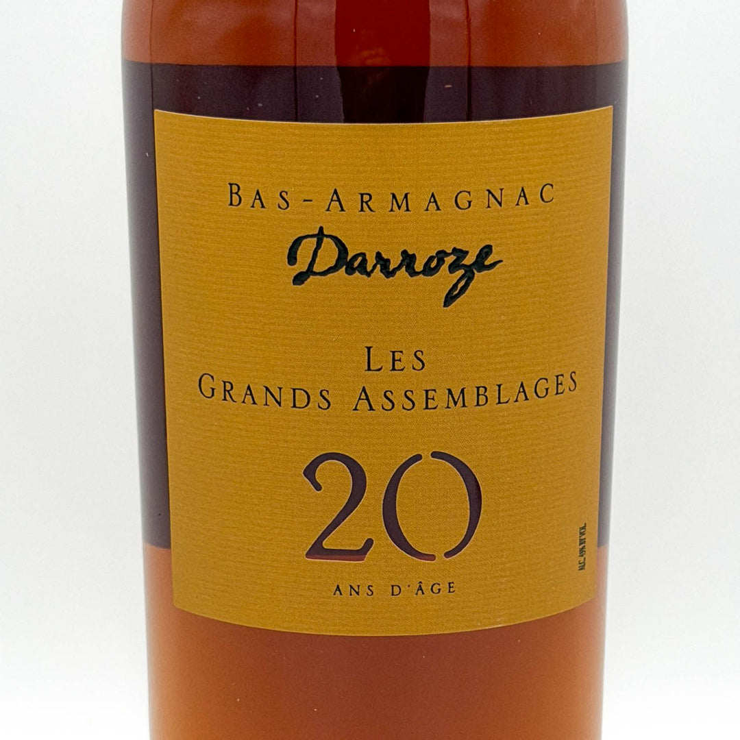 Bottle of Bas-Armagnac Darroze Les Grands Assemblages 20 Ans d'Age with a yellow label on a white background