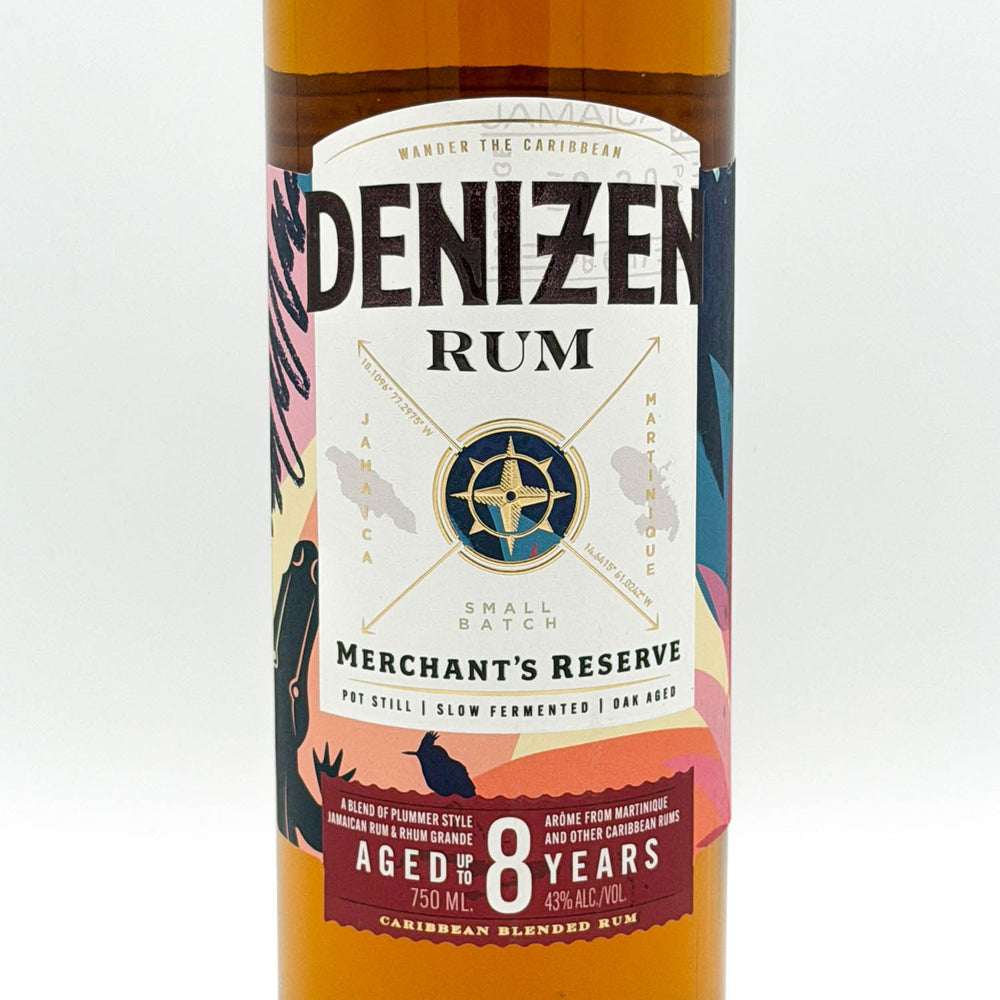 Denizen Rum bottle with colorful label on a white background