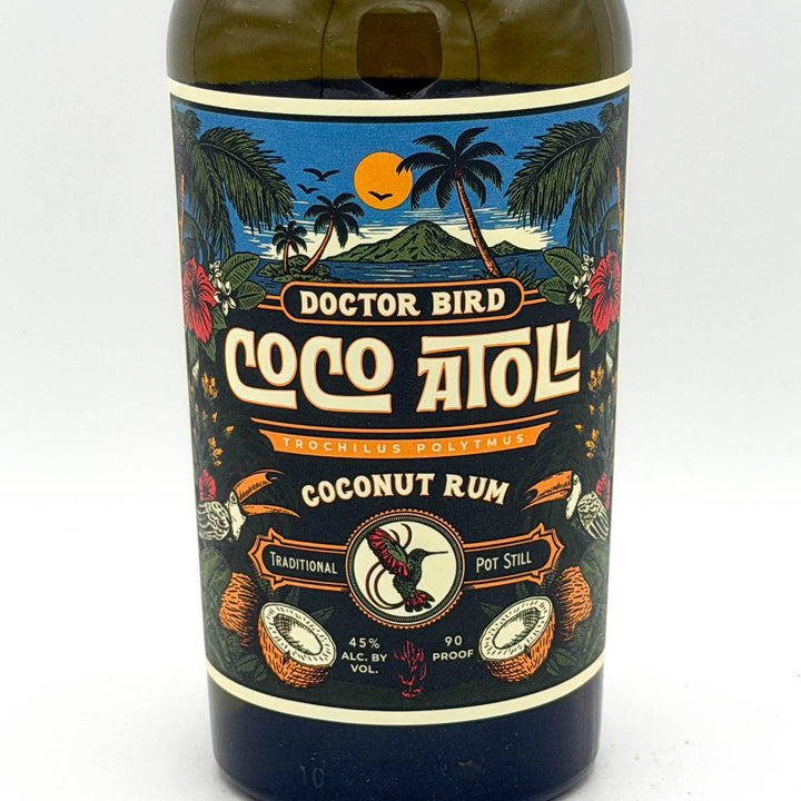Bottle of Doctor Bird Coco Atoll Coconut Rum with a colorful label on a white background