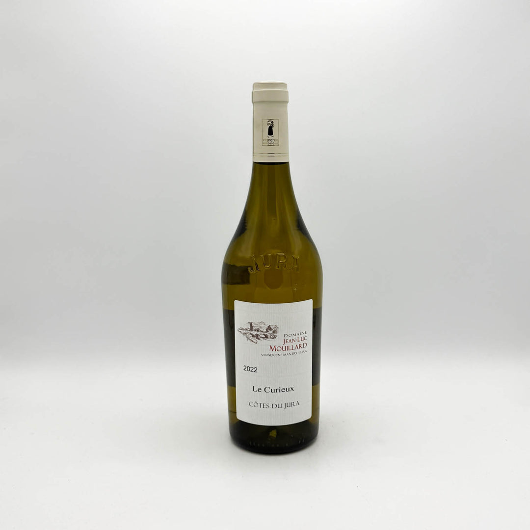 Wine bottle labeled 'Le Curieux' on a white background