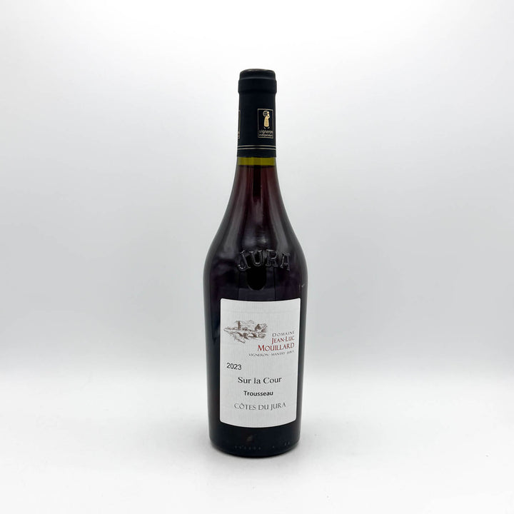 Wine bottle with a label on a white background