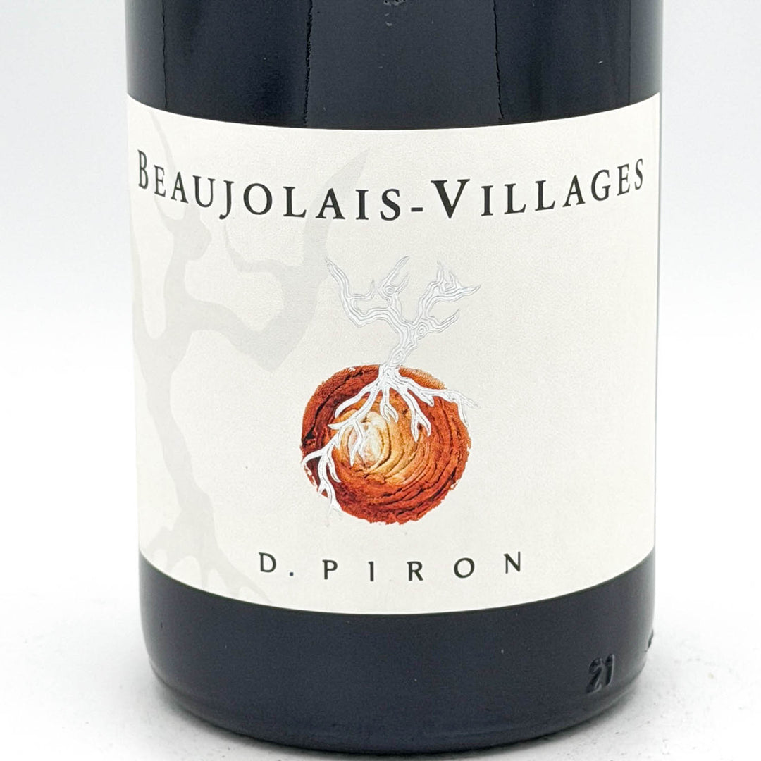 Wine bottle labeled 'Beaujolais-Villages' by D. Piron on a white background
