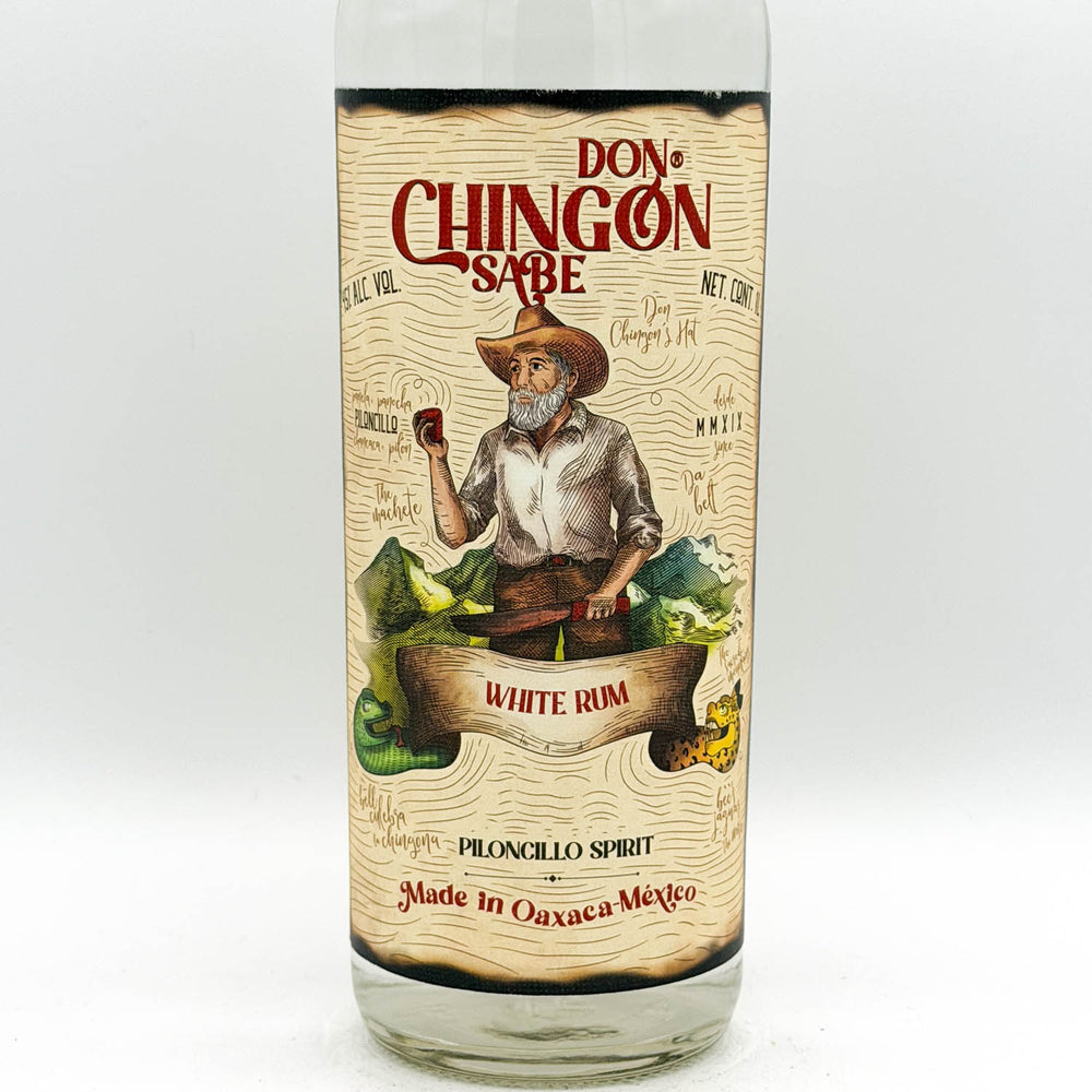 Bottle of Don Chingon Sabe White Rum with a label featuring a person in a cowboy hat and boots.