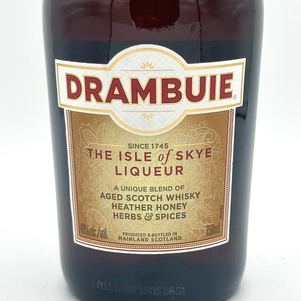 Drambuie liqueur bottle with label on a white background