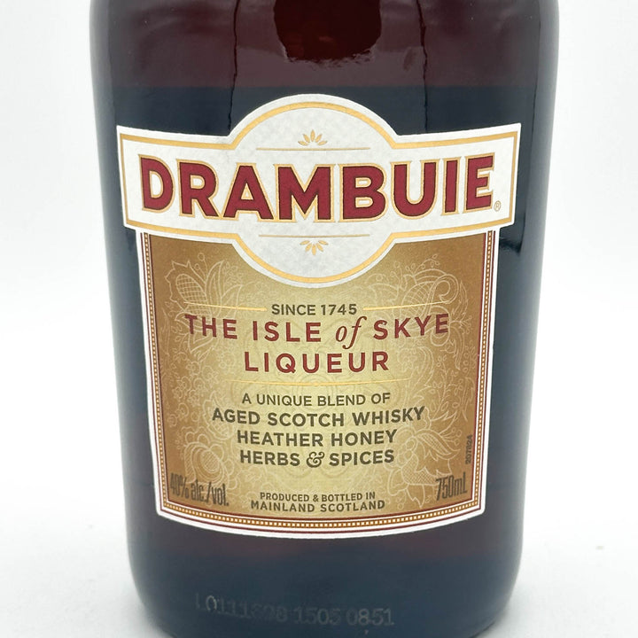 Drambuie liqueur bottle with label on a white background