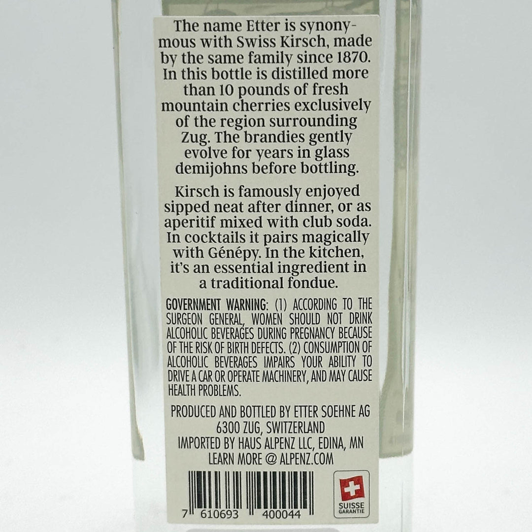 Back label of a Etter Kirsch bottle with text and branding details.