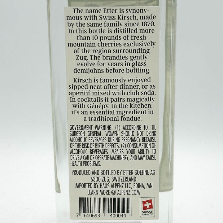 Back label of a Etter Kirsch bottle with text and branding details.