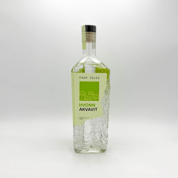 Bottle of Hvonn Akvavit with a green label on a white background