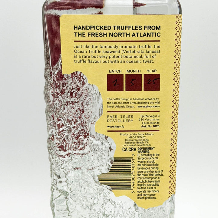 Bottle of Ocean Truffle Seaweed with a yellow label on a white background