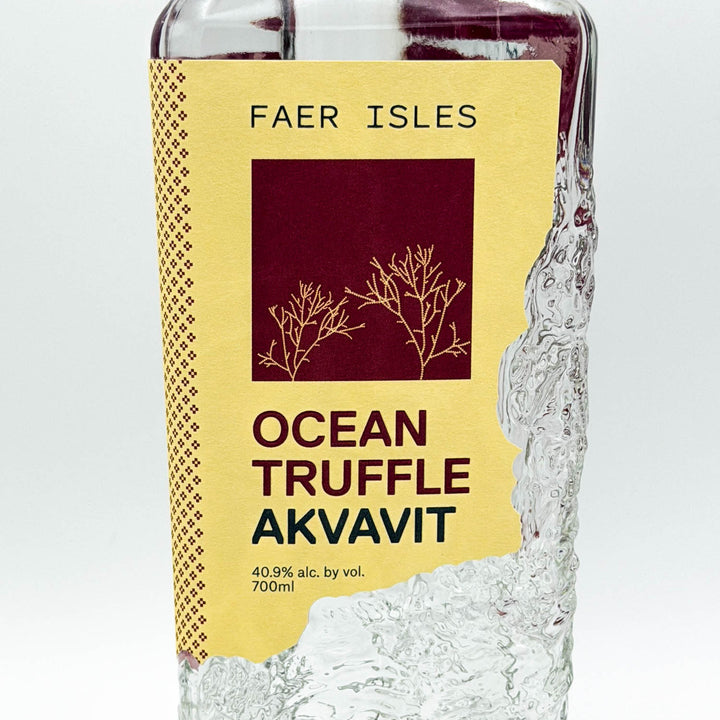 Bottle of Faer Isles Ocean Truffle Akvavit with a yellow label on a white background