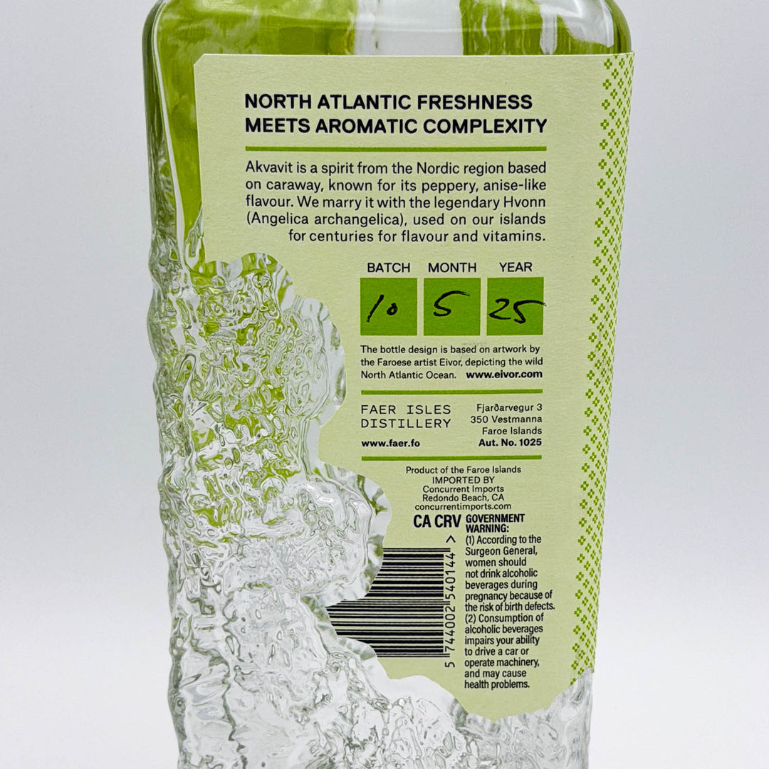 Alcoholic beverage bottle with green label on a white background
