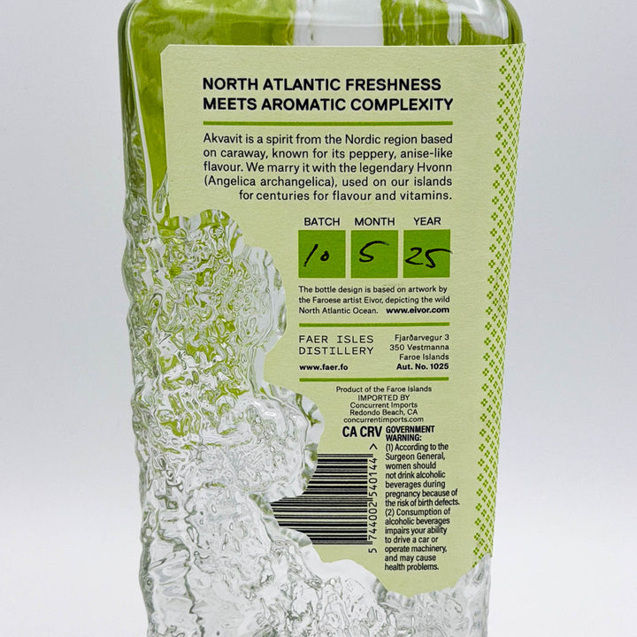 Alcoholic beverage bottle with green label on a white background