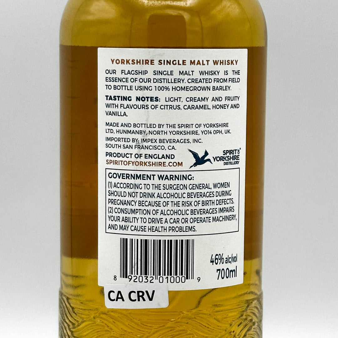 Bottle of Yorkshire Single Malt Whisky with label on a white background